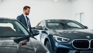 Professional analyzing cars at a sito per vendere auto usate with confident staff and well-lit